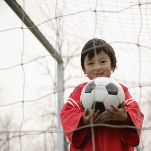 Boy-with-soccer-ball-MP900430649